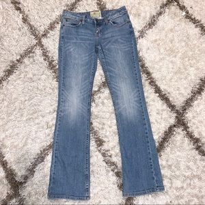 American Rag medium wash boot cut jeans